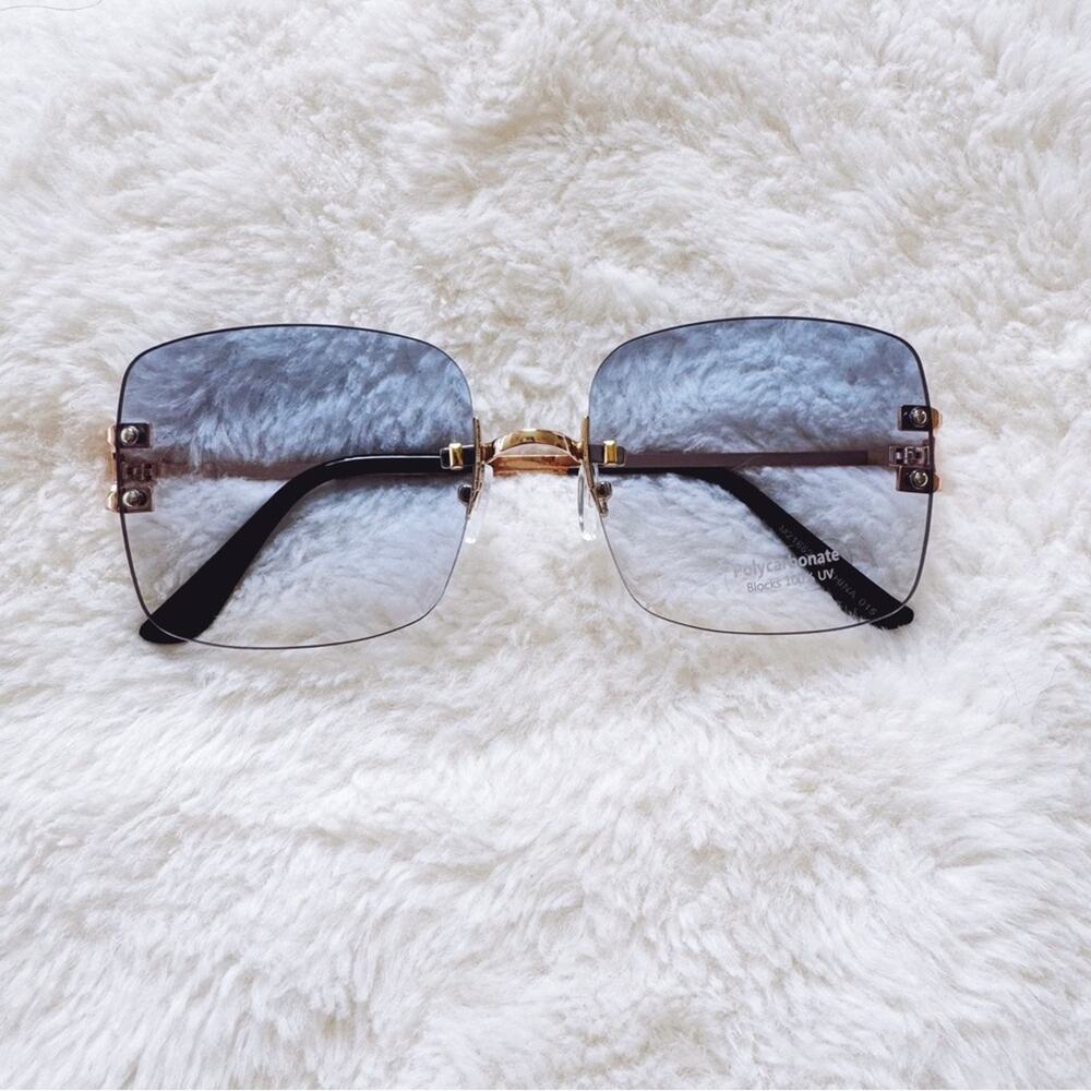 Laurel Clear Blue Rimless Sleek Sunglasses